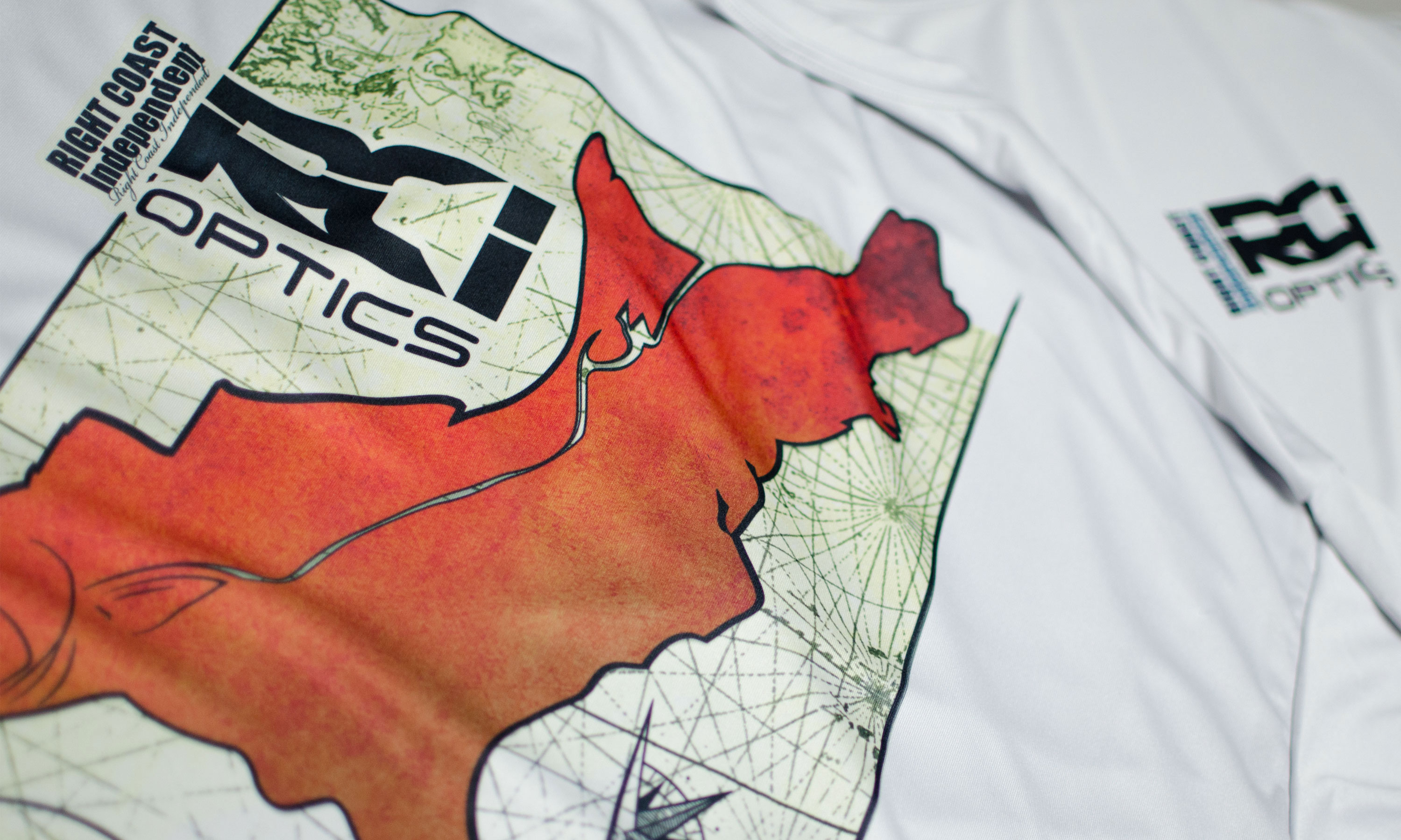 Closeup of RCI Optics graphic printed on shirt